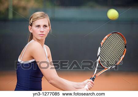 Young girl playing tennis View Large Photo Image Stock Photography - Young girl playing tennis. Fotosearch