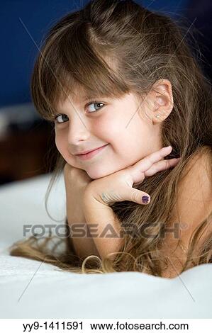 Young girl posing for camera - Fort Lauderdale, Florida USA View Large Photo Image Stock Image - Young girl posing for camera - Fort Lauderdale, Florida USA. Fotosearch