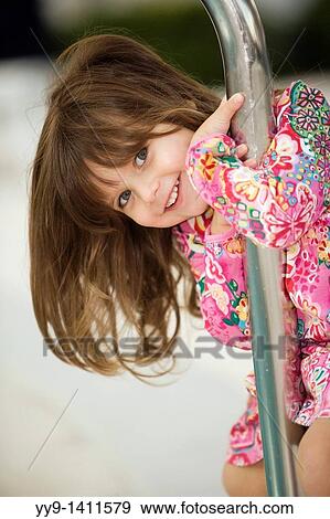 Young girl posing for picture by pool - Pompano Beach, Florida View Large Photo Image Stock Photo - Young girl posing for picture by pool - Pompano Beach, Florida. Fotosearch