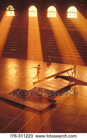 Young girl practicing on balance beam. View Large Photo Image Stock Image - Young girl practicing on balance beam.. Fotosearch