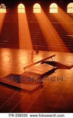Young girl practicing on balance beam View Large Photo Image Stock Photography - Young girl practicing on balance beam. Fotosearch