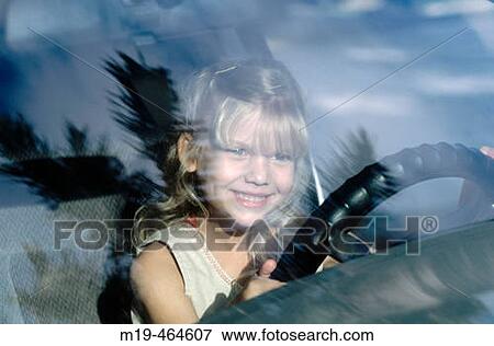 young girl pretending to drive View Large Photo Image Stock Photo - young girl pretending to drive. Fotosearch