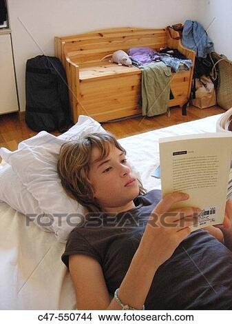 Picture - Young girl reading. Fotosearch
