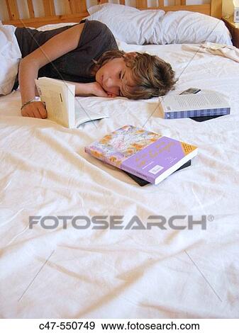 Stock Photo - Young girl reading. Fotosearch