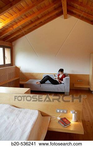 Stock Image - Young girl relaxing in a Villa at Aranzazu, Aizkorri Natural Park, near Oati. Gipuzkoa, Basque Country, Spain. Fotosearch