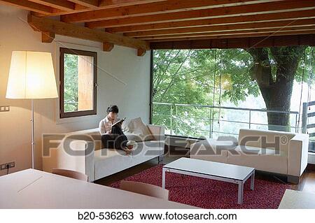 Young girl relaxing in a Villa at Aranzazu, Aizkorri Natural Park, near Oati. Gipuzkoa, Basque Country, Spain View Large Photo Image Stock Image - Young girl relaxing in a Villa at Aranzazu, Aizkorri Natural Park, near Oati. Gipuzkoa, Basque Country, Spain. Fotosearch