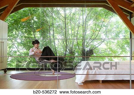 Young girl relaxing in a Villa at Aranzazu, Aizkorri Natural Park, near Oati. Gipuzkoa, Basque Country, Spain View Large Photo Image Stock Image - Young girl relaxing in a Villa at Aranzazu, Aizkorri Natural Park, near Oati. Gipuzkoa, Basque Country, Spain. Fotosearch