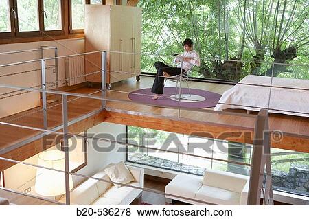 Young girl relaxing in a Villa at Aranzazu, Aizkorri Natural Park, near Oati. Gipuzkoa, Basque Country, Spain View Large Photo Image Stock Photo - Young girl relaxing in a Villa at Aranzazu, Aizkorri Natural Park, near Oati. Gipuzkoa, Basque Country, Spain. Fotosearch