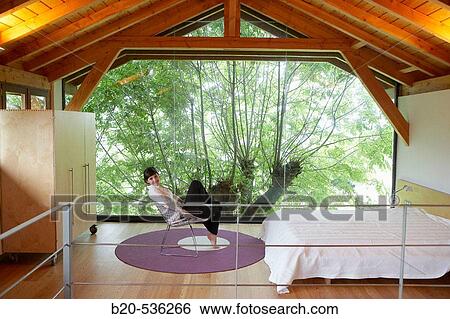 Stock Photograph - Young girl relaxing in a Villa at Aranzazu, Aizkorri Natural Park, near Oati. Gipuzkoa, Basque Country, Spain. Fotosearch