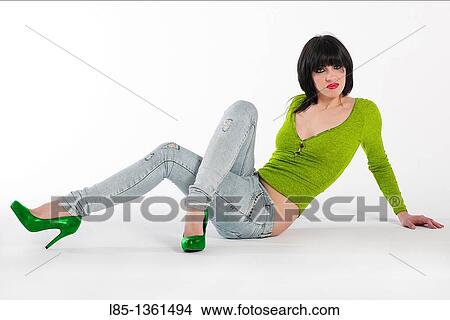 Young girl resting on the floor on a white background View Large Photo Image Picture - Young girl resting on the floor on a white background. Fotosearch