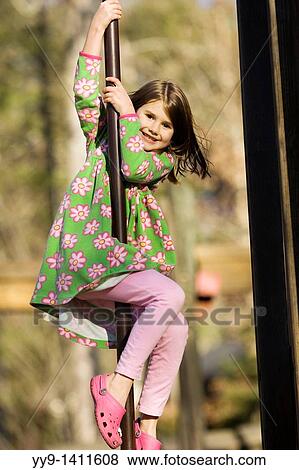 Young girl sliding on pole at playground - Franklin Park - Brevard, North Carolina View Large Photo Image Stock Photo - Young girl sliding on pole at playground - Franklin Park - Brevard, North Carolina. Fotosearch