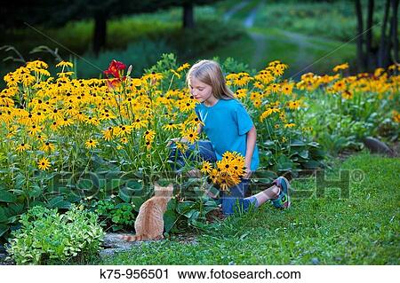 young girl smelling flowers View Large Photo Image Stock Image - young girl smelling flowers. Fotosearch