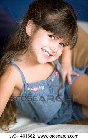 Young Girl Smiling and Posing for Camera - Fort Lauderdale, Florida, USA View Large Photo Image Stock Image - Young Girl Smiling and Posing for Camera - Fort Lauderdale, Florida, USA. Fotosearch