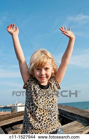 young girl smiling and waving, Brighton, East sussex, England, Europe, UK View Large Photo Image Picture - young girl smiling and waving, Brighton, East sussex, England, Europe, UK. Fotosearch
