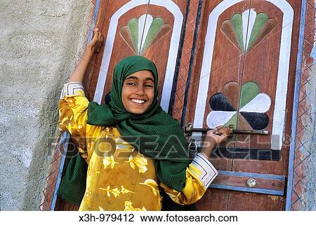 Stock Image - young girl smiling in Tiwi, Sultanate of Oman, Arabian Peninsula, Asia. Fotosearch