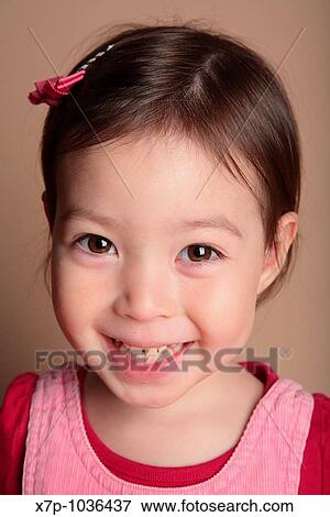 Stock Photo - young girl smiling. Fotosearch