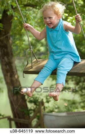 young girl swinging and laughing. Greenbrier River, WV View Large Photo Image Stock Photo - young girl swinging and laughing. Greenbrier River, WV. Fotosearch