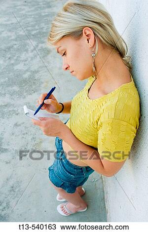 Young girl taking notes View Large Photo Image Stock Image - Young girl taking notes. Fotosearch