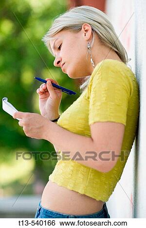 Young girl taking notes View Large Photo Image Stock Photograph - Young girl taking notes. Fotosearch