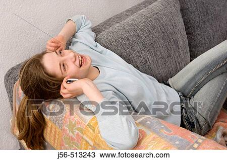 Young girl talking on telephone View Large Photo Image Stock Image - Young girl talking on telephone. Fotosearch