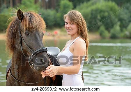 Young girl with an brown icelandic horse in summer, Bavaria, Germany. View Large Photo Image Stock Image - Young girl with an brown icelandic horse in summer, Bavaria, Germany.. Fotosearch