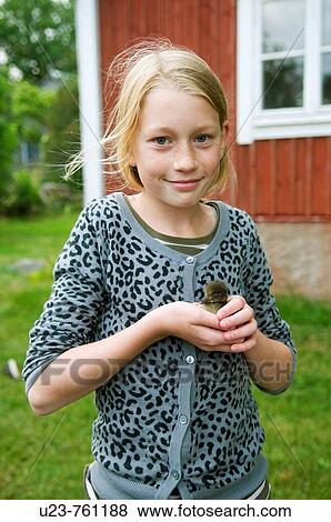 Young girl with baby duck on her hand. View Large Photo Image Stock Photo - Young girl with baby duck on her hand.. Fotosearch