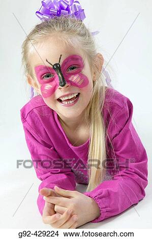 Young girl with bodypaint, butterfly painted in face. View Large Photo Image Picture - Young girl with bodypaint, butterfly painted in face.. Fotosearch