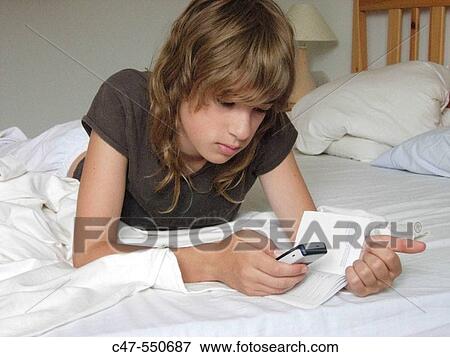 Young girl with cell phone View Large Photo Image Stock Photo - Young girl with cell phone. Fotosearch