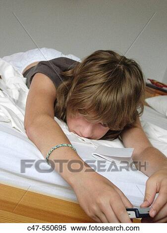 Stock Photography - Young girl with cell phone. Fotosearch