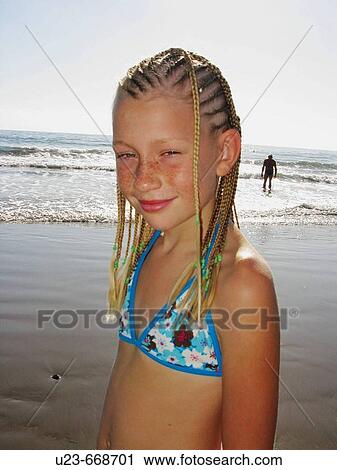 Young girl with dreadlocks on a beach View Large Photo Image Stock Image - Young girl with dreadlocks on a beach. Fotosearch