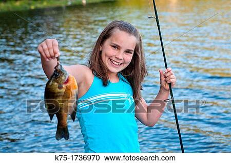 Young girl with her sunfish catch View Large Photo Image Stock Image - Young girl with her sunfish catch. Fotosearch