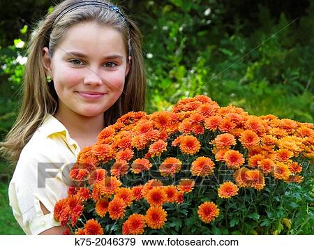 Young girl with large bunch of mums View Large Photo Image Stock Photo - Young girl with large bunch of mums. Fotosearch