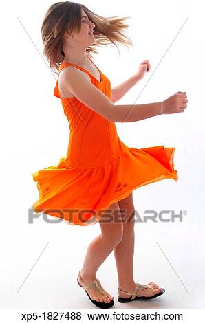 Young girl with orange dress View Large Photo Image Stock Photo - Young girl with orange dress. Fotosearch