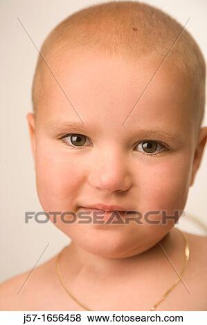 Young girl with pediatric cancer playing in studio with scarf View Large Photo Image Stock Photo - Young girl with pediatric cancer playing in studio with scarf. Fotosearch