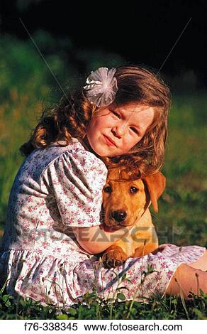 Young girl with yellow lab puppy View Large Photo Image Stock Photography - Young girl with yellow lab puppy. Fotosearch