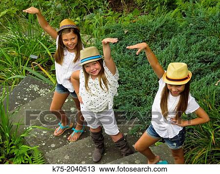 Young girls fooling around View Large Photo Image Stock Image - Young girls fooling around. Fotosearch