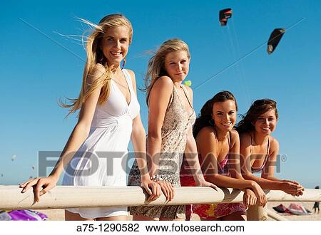 Young girls on the beach View Large Photo Image Stock Image - Young girls on the beach. Fotosearch