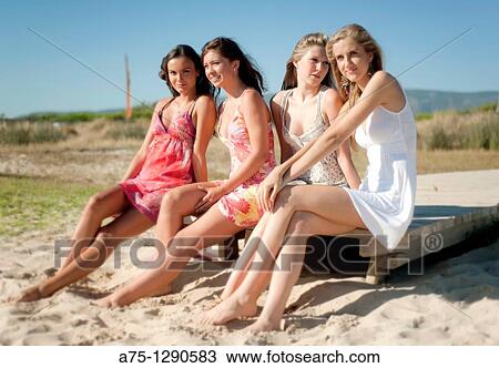 Young girls on the beach View Large Photo Image Stock Image - Young girls on the beach. Fotosearch