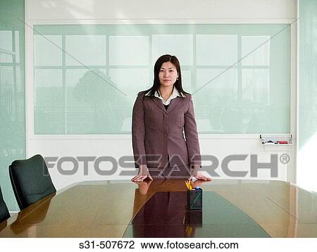 Stock Image - Young good looking asian businesswoman. Fotosearch