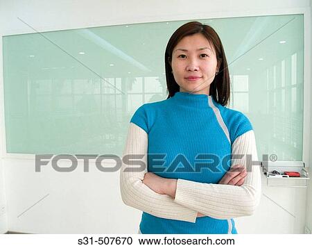 Young good looking asian executive in a meeting room View Large Photo Image Stock Image - Young good looking asian executive in a meeting room. Fotosearch