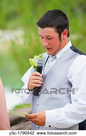 Young groom saying wedding vow to his bride at their outdoor wedding in Texas, USA View Large Photo Image Stock Image - Young groom saying wedding vow to his bride at their outdoor wedding in Texas, USA. Fotosearch