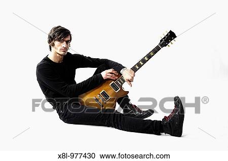 Young guitarist posing View Large Photo Image Stock Image - Young guitarist posing. Fotosearch
