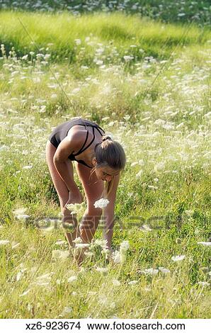 young gymnast gathering flowers in a meadow in the Pyrenees View Large Photo Image Picture - young gymnast gathering flowers in a meadow in the Pyrenees. Fotosearch