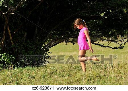 young gymnast walking in a meadow in the Pyrenees View Large Photo Image Stock Image - young gymnast walking in a meadow in the Pyrenees. Fotosearch