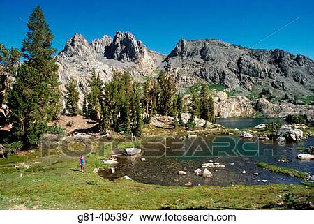 Young hiker along tarn above Minaret Lake, Ansel Adams Wilderness, Sierra Nevada Mountains, California View Large Photo Image Stock Photo - Young hiker along tarn above Minaret Lake, Ansel Adams Wilderness, Sierra Nevada Mountains, California. Fotosearch