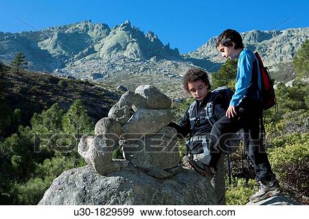 Stock Photo - Young hikers walking in Domingo Fernando, Sierra de Gredos Regional Park El Hornillo Arenas de San Pedro? vila province Castilla y Le? n Spain. Fotosearch