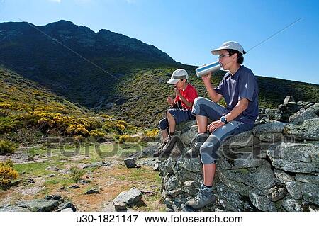 Young hikers walking to Torozo peak in Sierra de Gredos? vila province Castilla y Le? n Spain View Large Photo Image Stock Photo - Young hikers walking to Torozo peak in Sierra de Gredos? vila province Castilla y Le? n Spain. Fotosearch