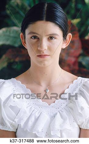 Young hispanic girl wearing white blouse View Large Photo Image Stock Photo - Young hispanic girl wearing white blouse. Fotosearch