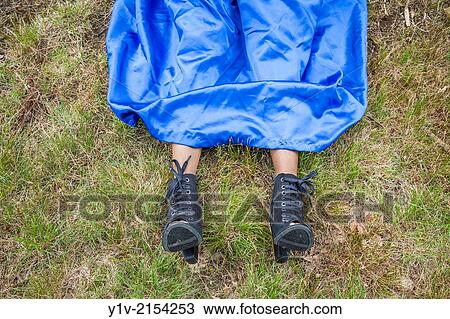 Stock Image - Young Hispanic woman's feet.. Fotosearch
