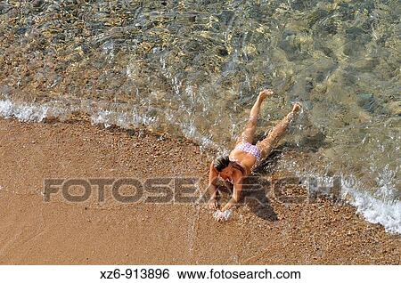 young in the beach View Large Photo Image Stock Photograph - young in the beach. Fotosearch